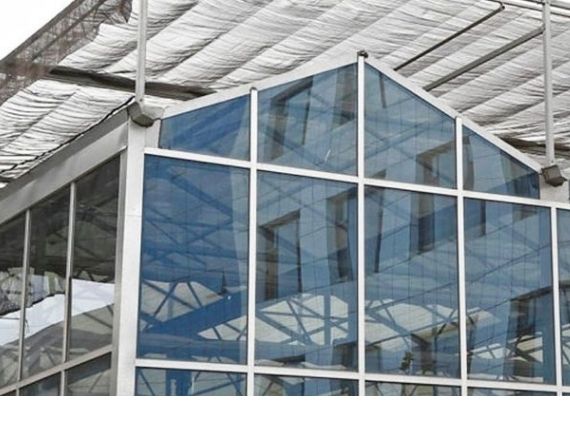 Industrial greenhouse with shade cloth